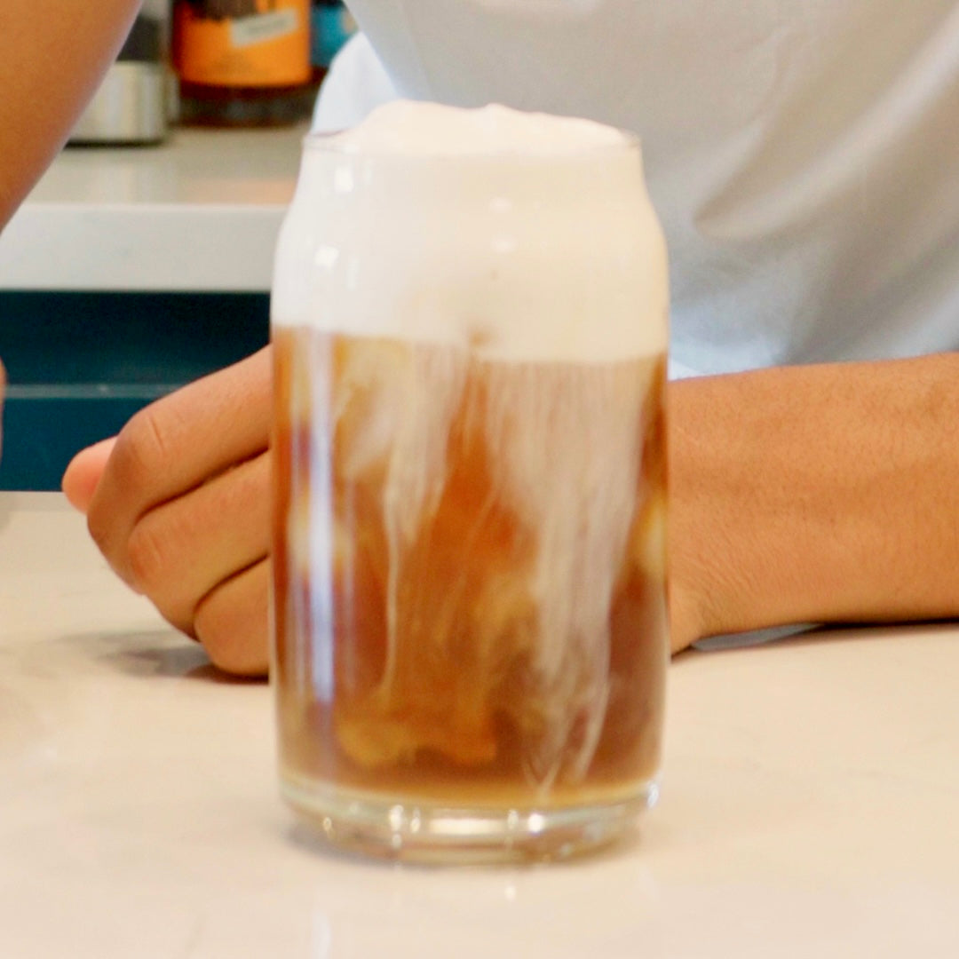 Vanilla Cold Foam served on an iced latte in a glass