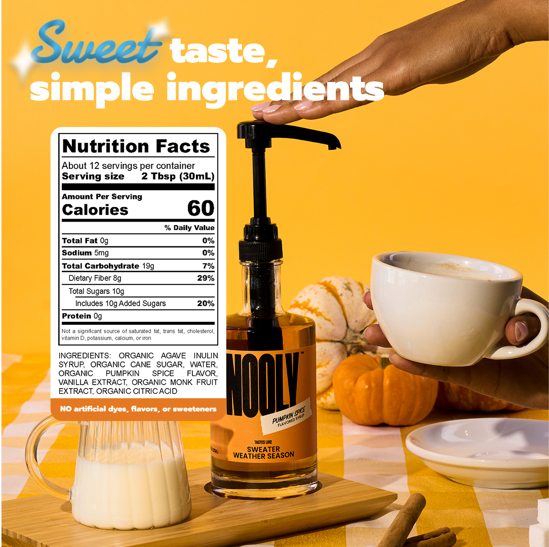 Bottle of Nooly pumpkin spice syrup for coffee with a nutrition label and pumpkin spice syrup recipe ingredients on a yellow background